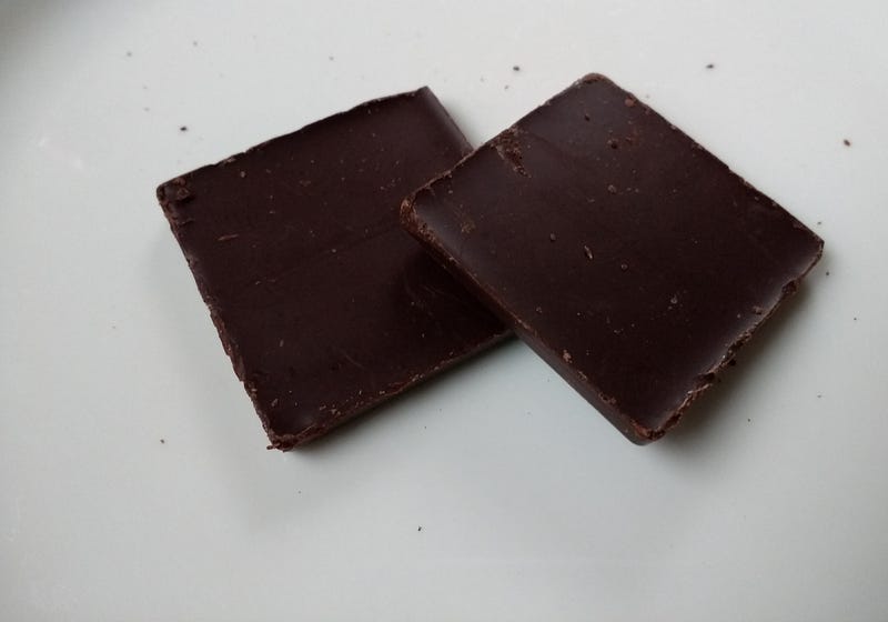 Two pieces of raw chocolate.