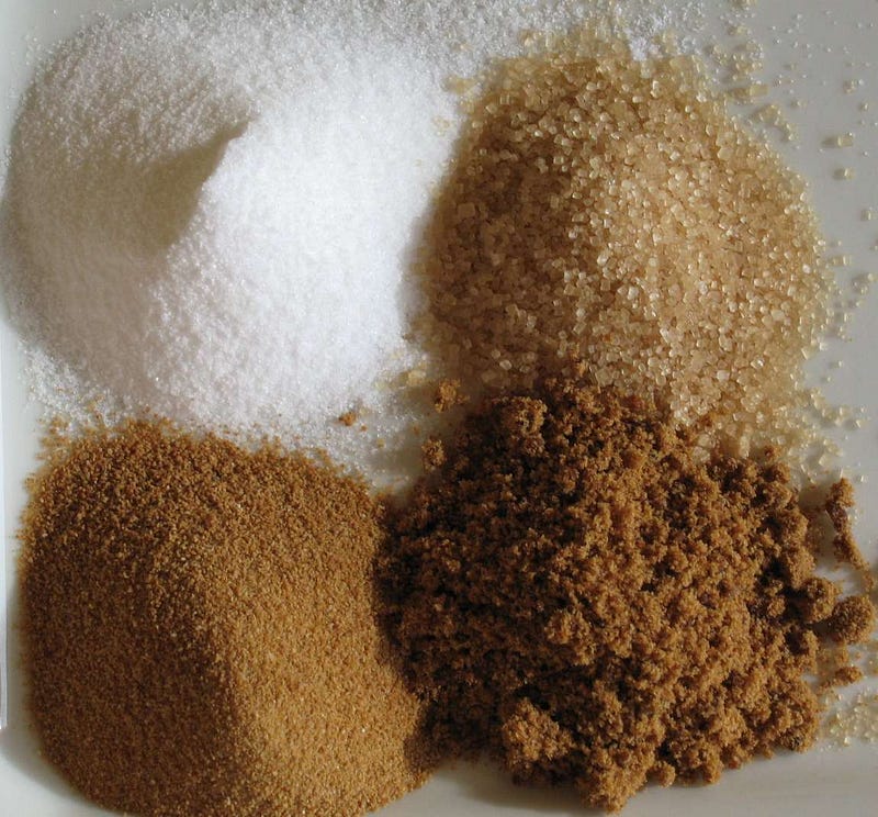 Sugar (clockwise from top left): white refined, unrefined, raw cane, brown.